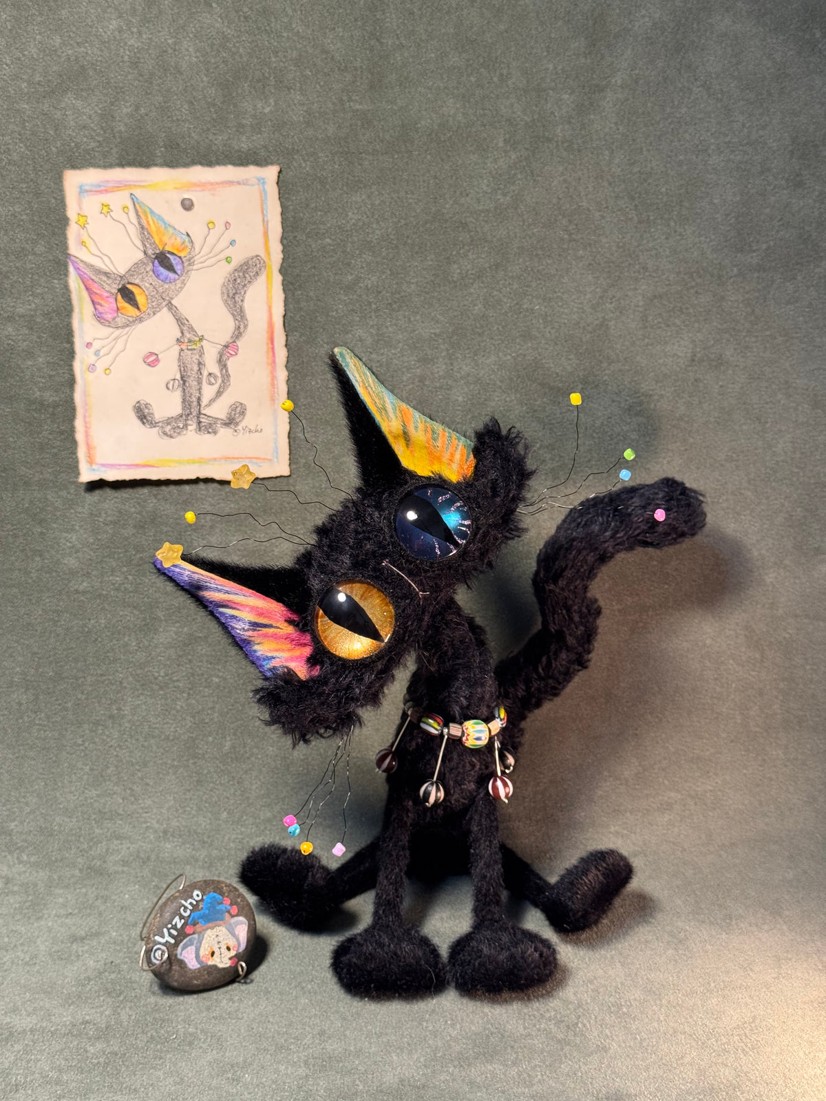 Portrait of this one-of-one Halloween black cat with its included colored hand-drawn sketch; the stone tag is not included