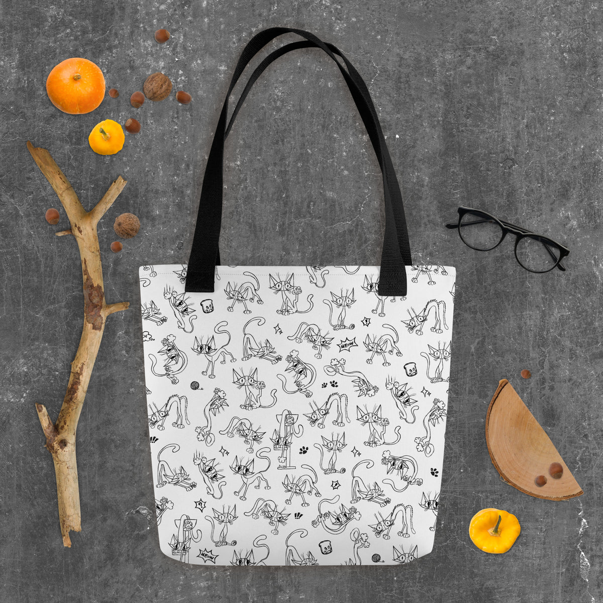 Printful Halloween flat-lay mockup of the Yizcho Cat Parade tote with seasonal props; props are not included.