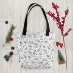 Printful holiday flat-lay mockup of the Yizcho Cat Parade tote on a wooden surface; props are not included.