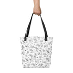 Printful mockup of the Yizcho Cat Parade tote held in one hand against a white background.